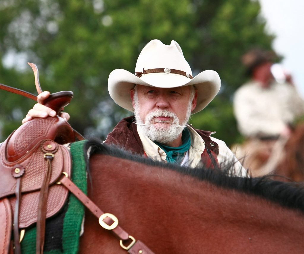 Michael Duty standing by horse